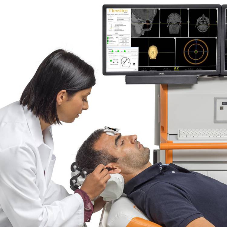 Doctor administrating TMS